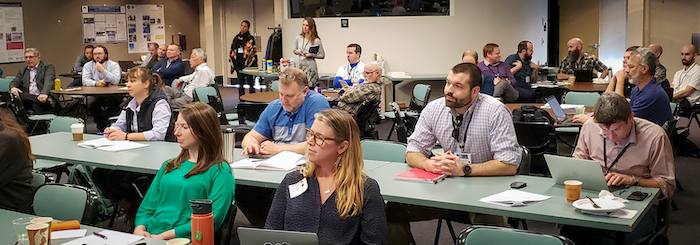 Figure 4. Attendees at the 2020 Polar Technology Conference listening to the oral presentations for one of the main themes. Each theme had a keynote presentation followed by two selected oral presentations. A question and answer session at the end of each provided dialogue between attendees and speakers. Photo provided by Zeb Polly, ARCUS.