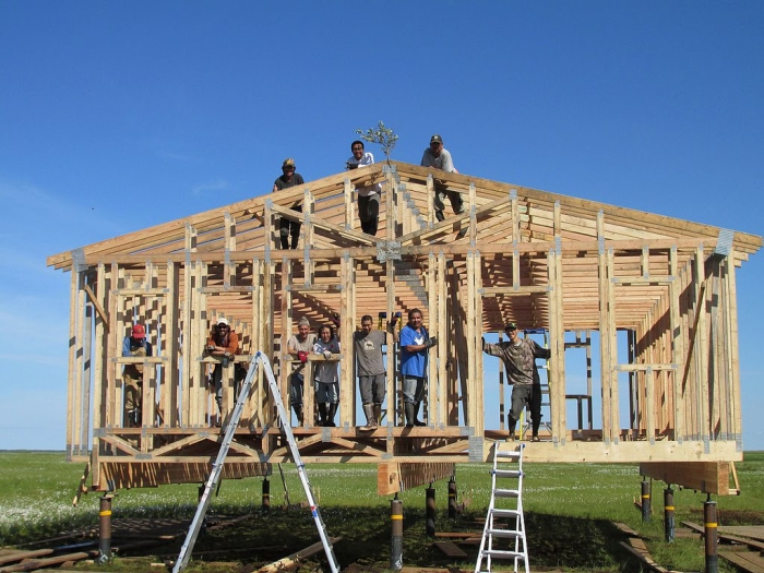 Figure 2. CCHRC works with remote Alaska communities to demonstrate affordable, culturally appropriate homes and train local workforces. In 2013, researchers built two high-efficiency homes with the Yup&#39;ik community of Atmautluak in southwest Alaska. Photo Courtesy of CCHRC.