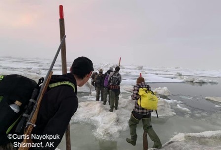 Walking across the ice with search and rescue.